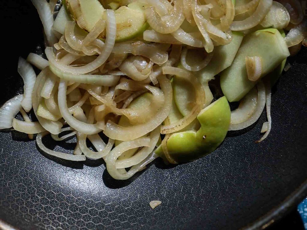 onions and apples in pan just starting to get some color